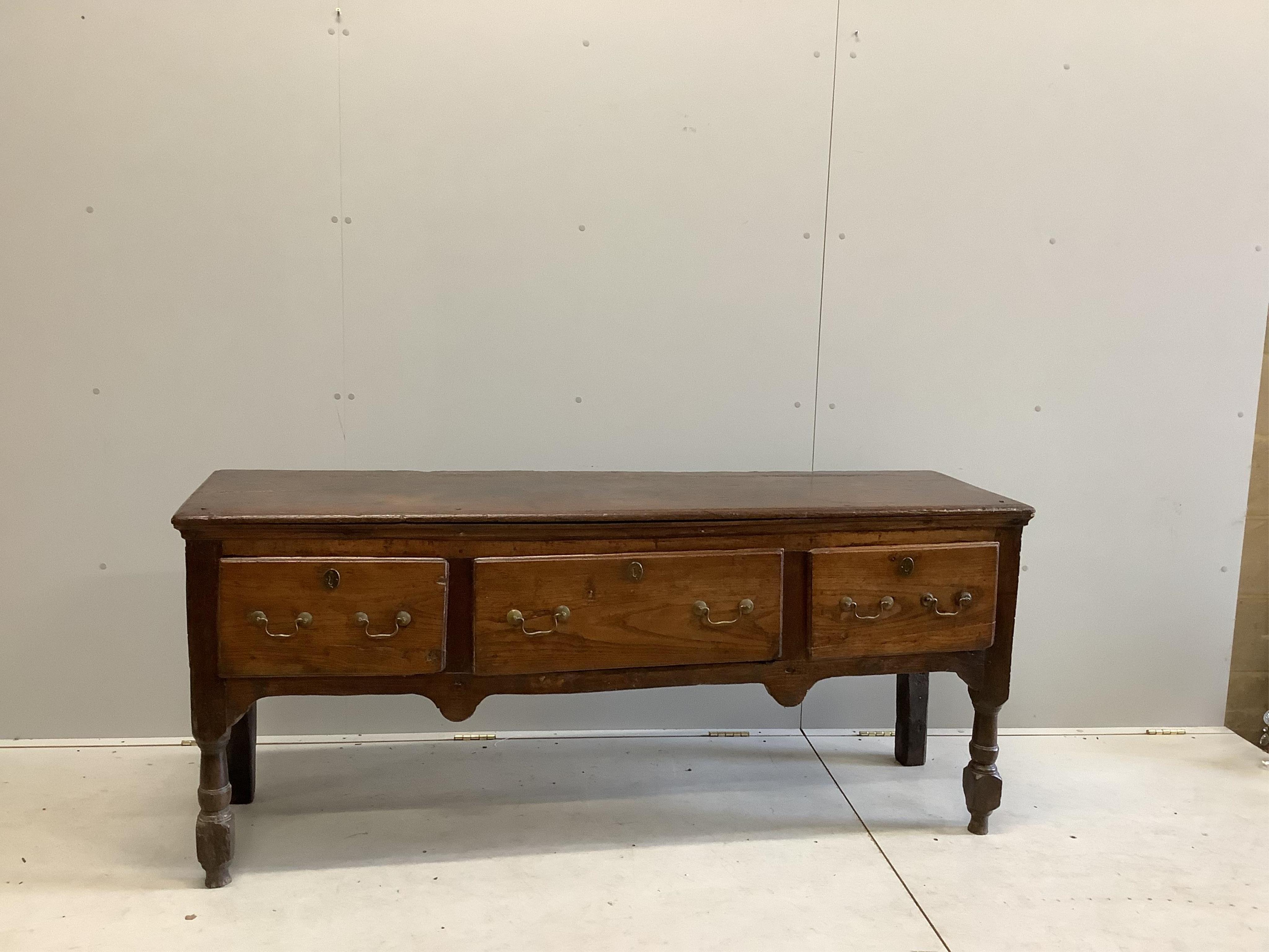 An 18th century oak low dresser, width 172cm, depth 46cm, height 74cm. Condition - poor to fair